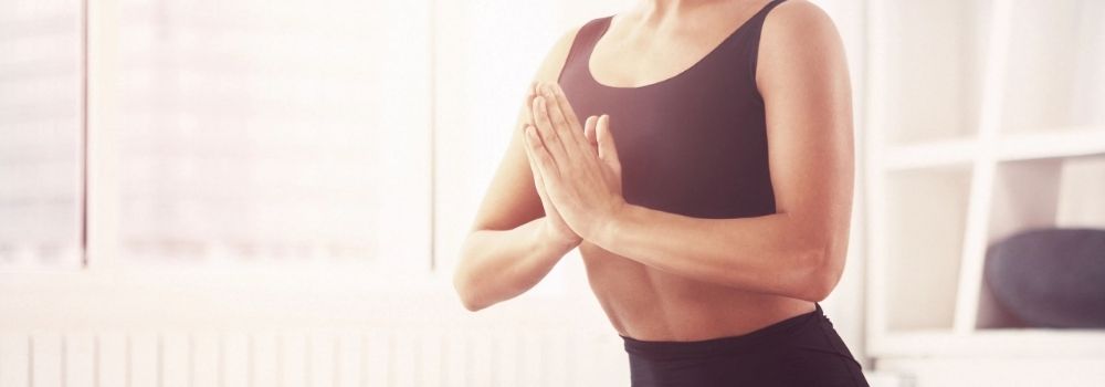 A playful dog in a yoga pose