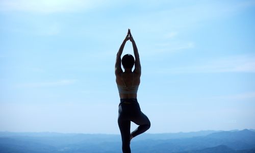 Instructor assisting a student in a dynamic flow